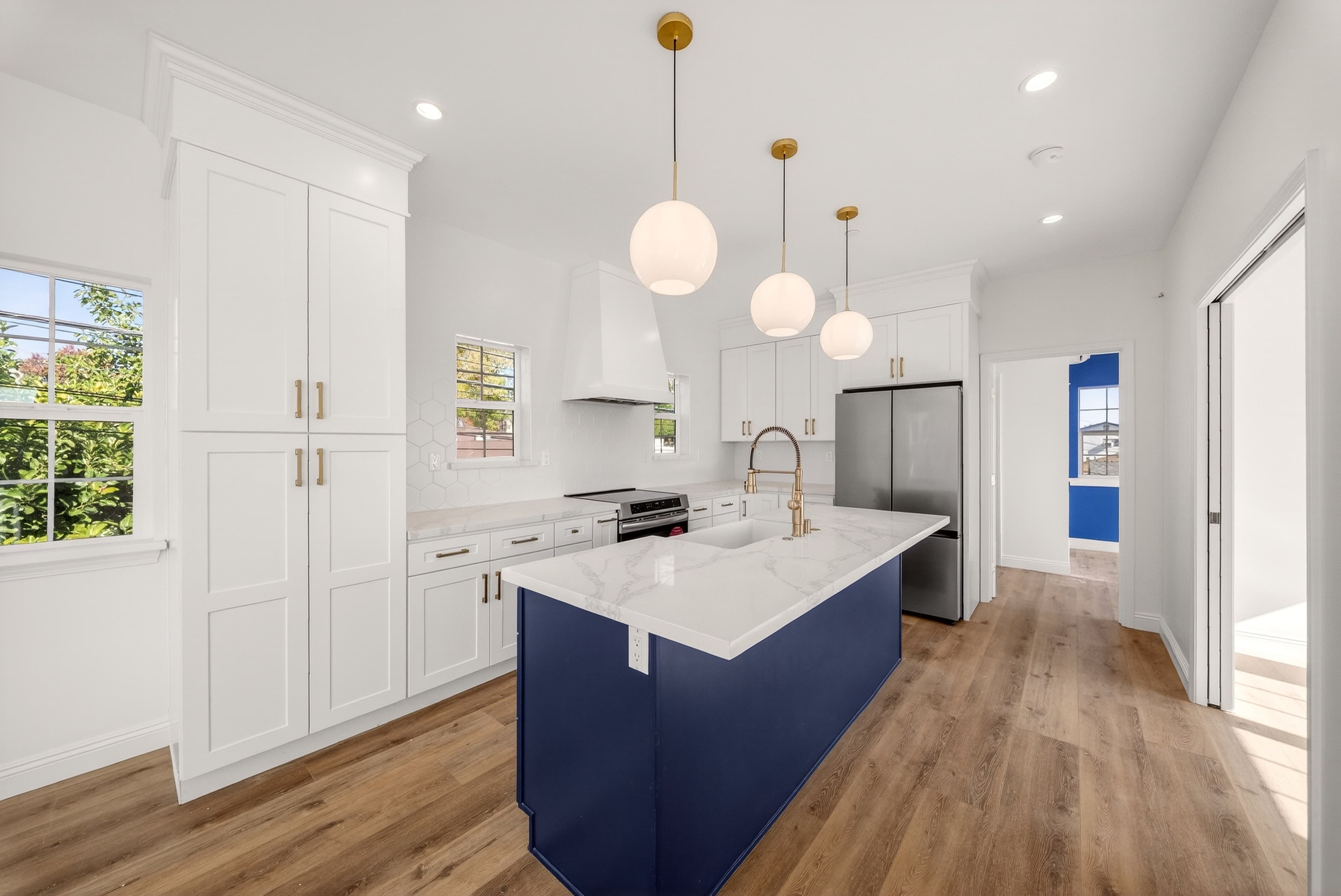 ADU kitchen with island and pendant lighting